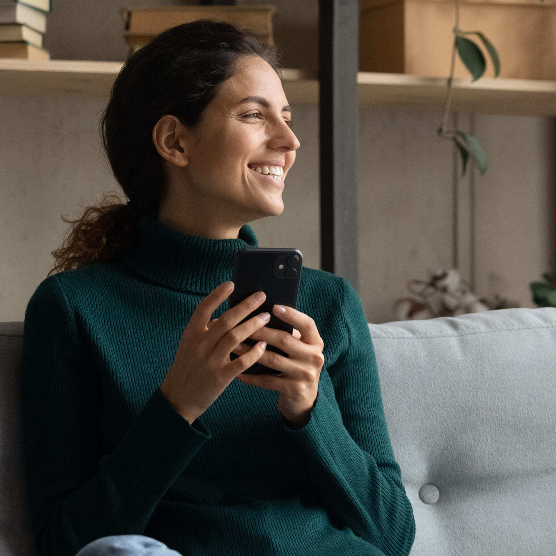 Lady smiling with phone